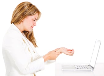 Businesswoman with a laptop suffering from carpal tunnel syndrome - isolated over a white background