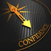 Confidence - Business Background. Golden Compass Needle on a Black Field Pointing to the Word Confidence. 3D Render.