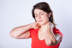 Young woman having neck pain after night